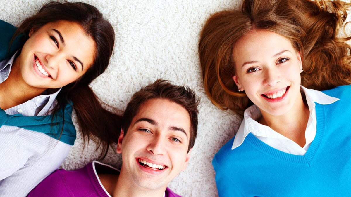 Photo of people with bright smiles